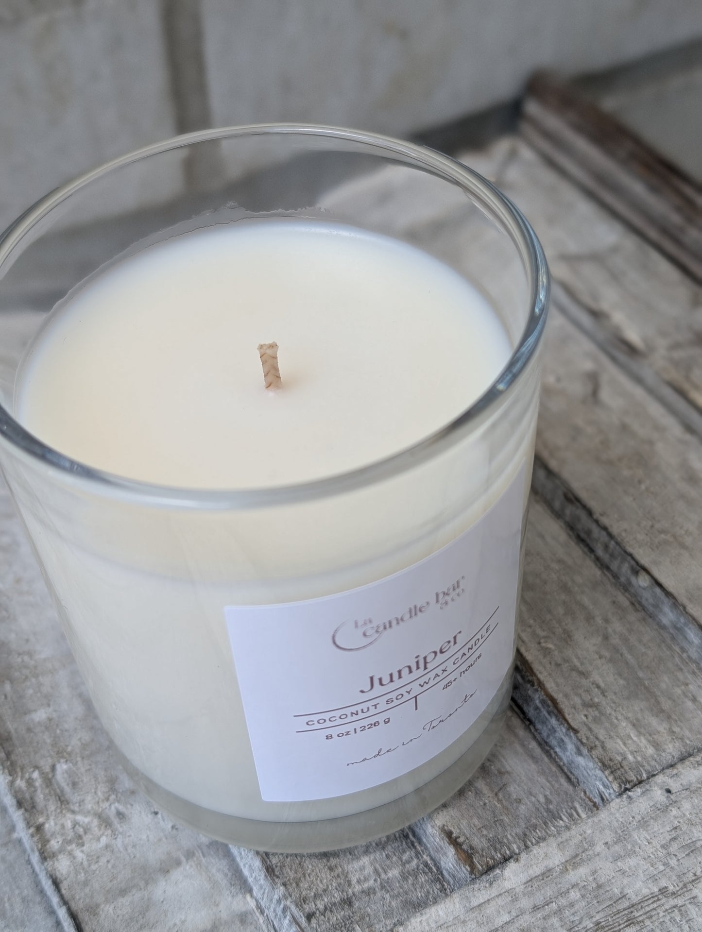 Hand-poured lemongrass coconut soy wax candle in an elegant glass vessel
