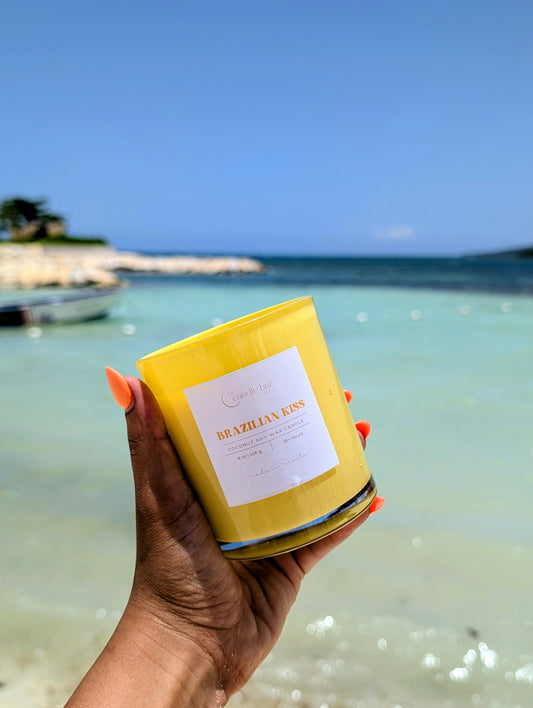 Inspired by the Sol de Janeiro Brazilian Crush, this candle is in a bright yellow jar candle featuring a warm gourmand scent profile with dominant notes of nutty pistachio, rich salted caramel, and creamy vanilla." 